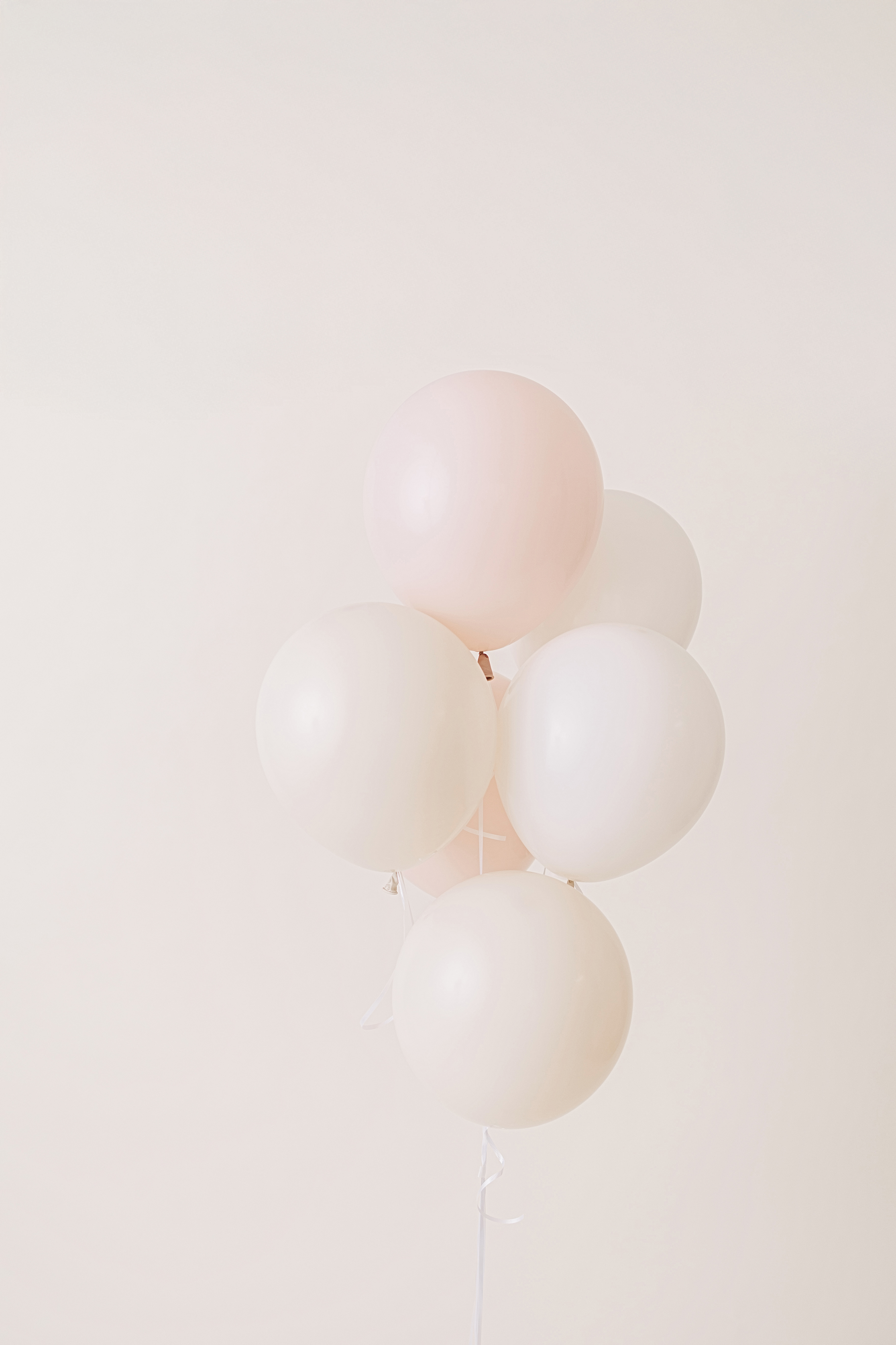 Blush and cream baby shower balloon garland styled in Long Beach
