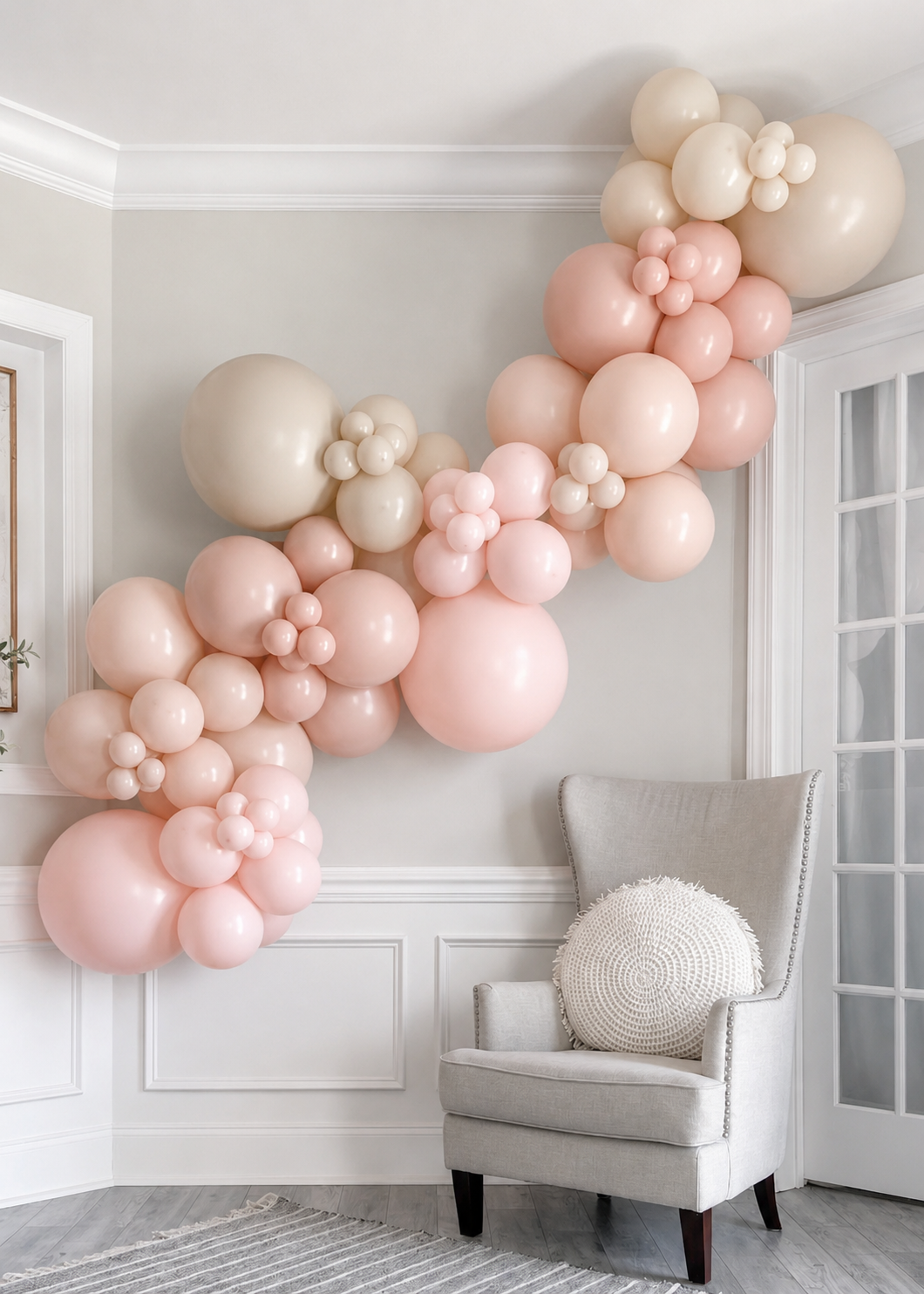 Blush and cream garland hung on a wall — a grab-and-go kit